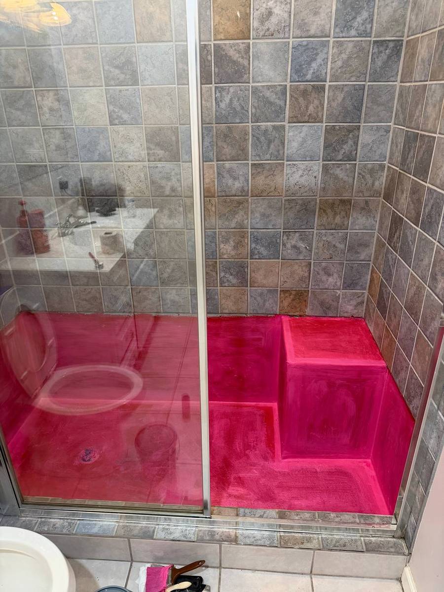 Full waterproofed shower pan and bench seat before new tile installation